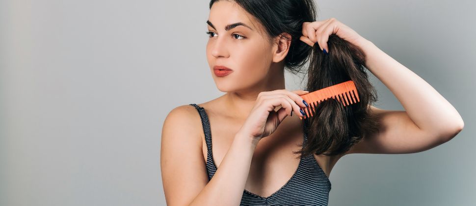 Oil Your Hair And Use A Wide-Toothed Comb